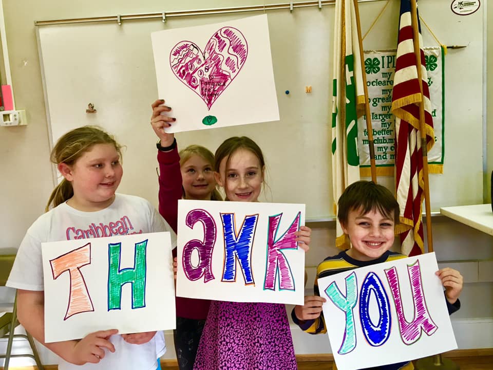 children with thank you sign